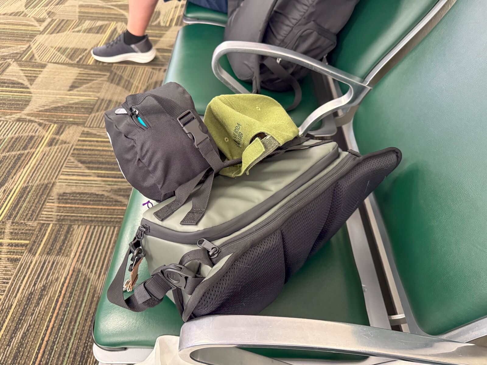 rogue sling on airport chair