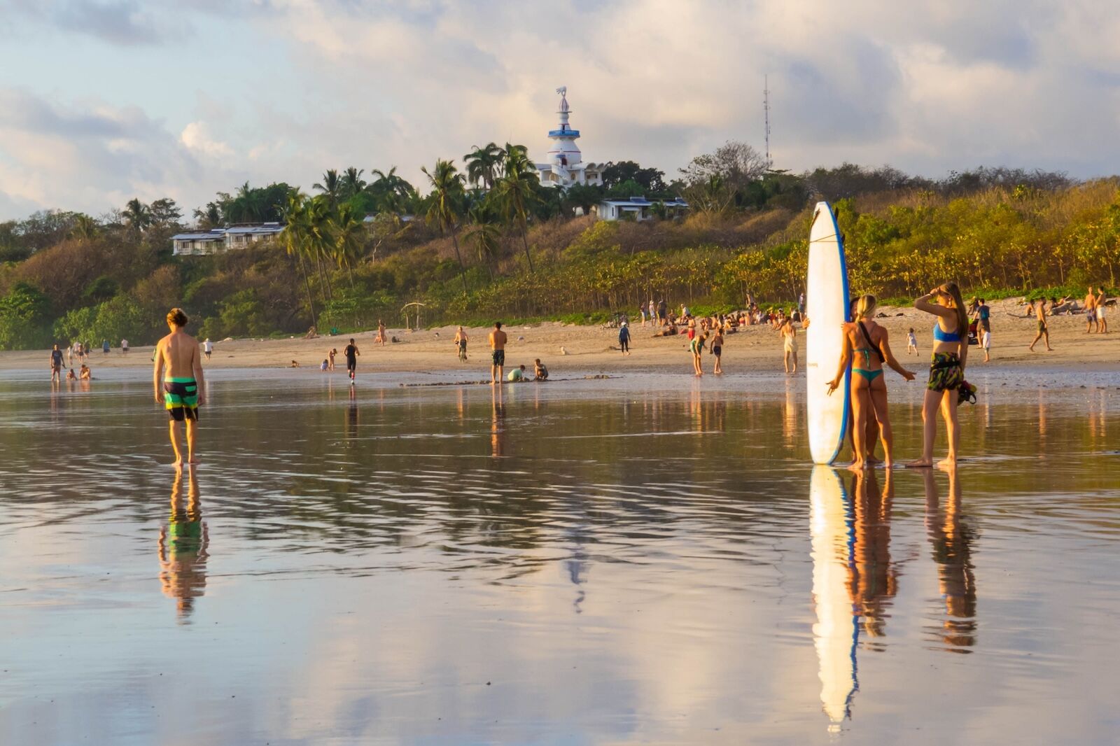 Nosara, Costa Rica - February 5, 2024: People on Guiones Beach at sunset.