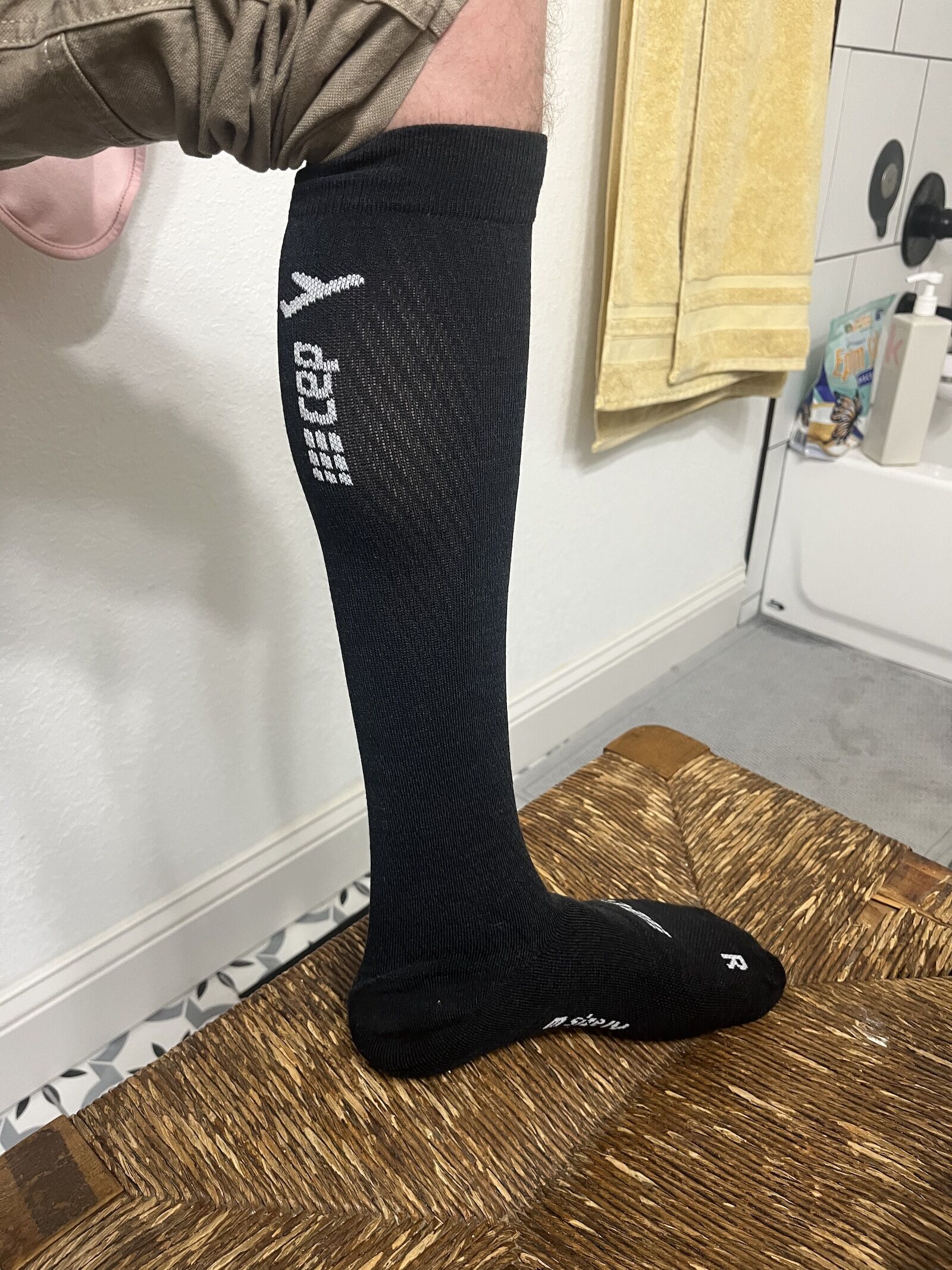 man wearing cep flight tall compression sock