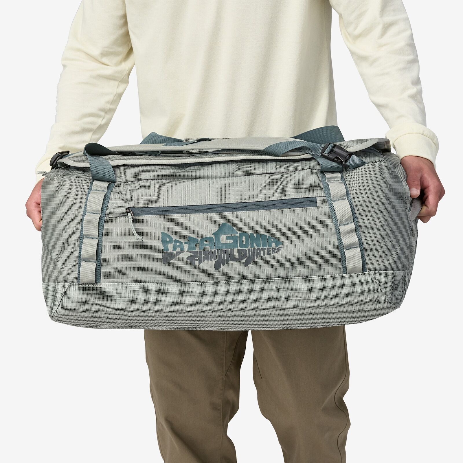 man holding patagonia black hole duffel