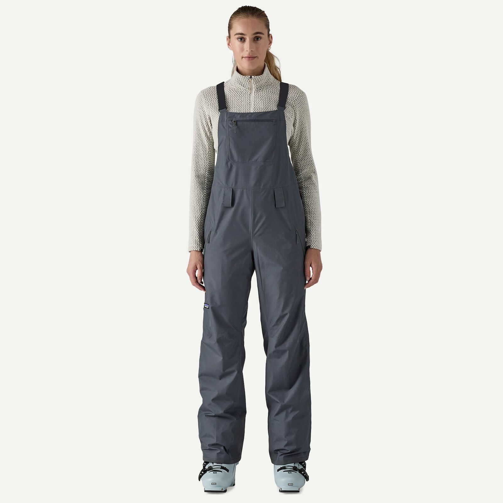 woman in patagonia powder town bibs