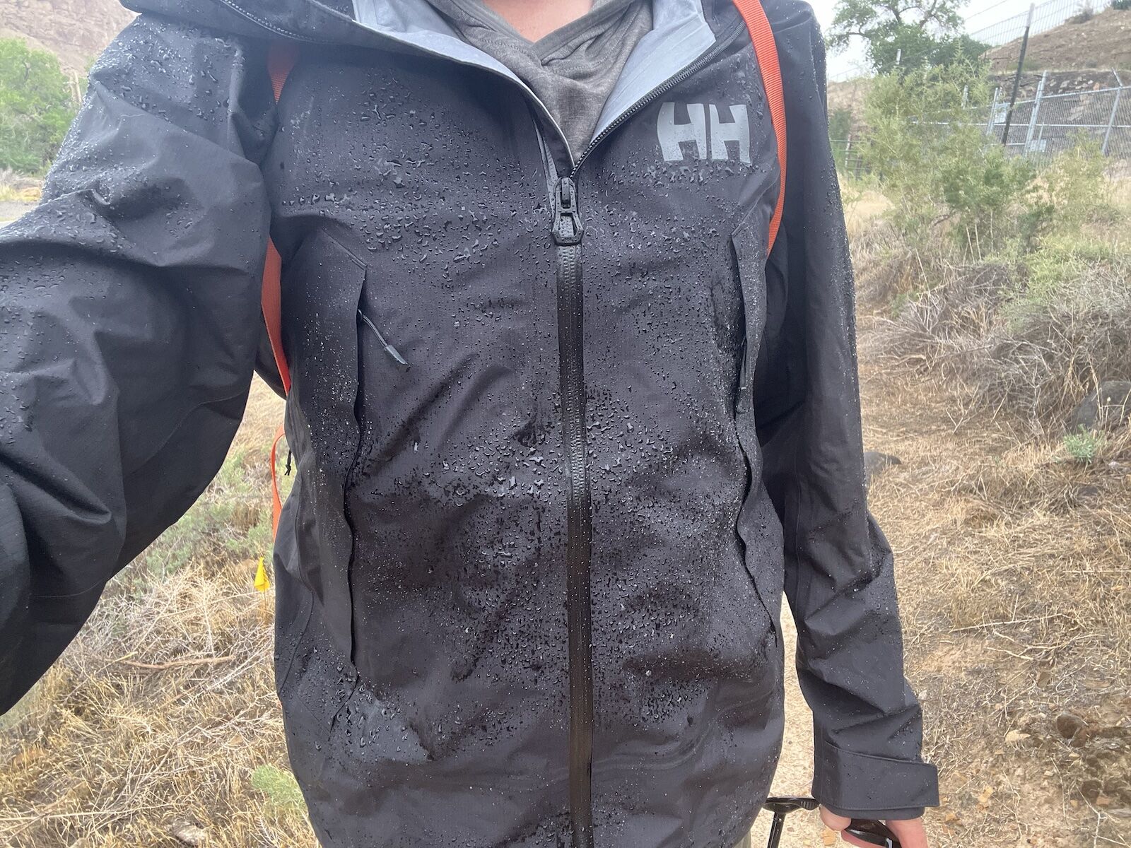 man in wet helly hansen verglas shell