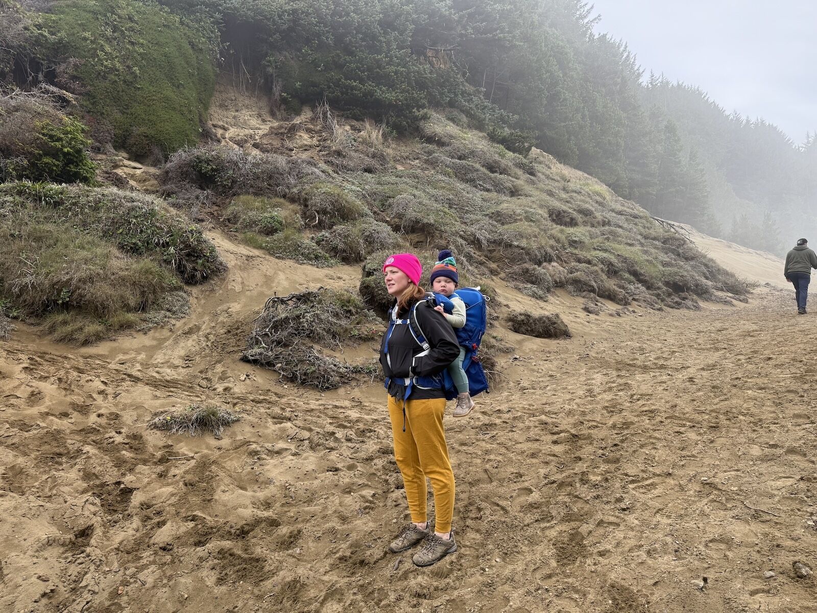 mother in fjallraven high coast trail jacket with baby in hiking backpack