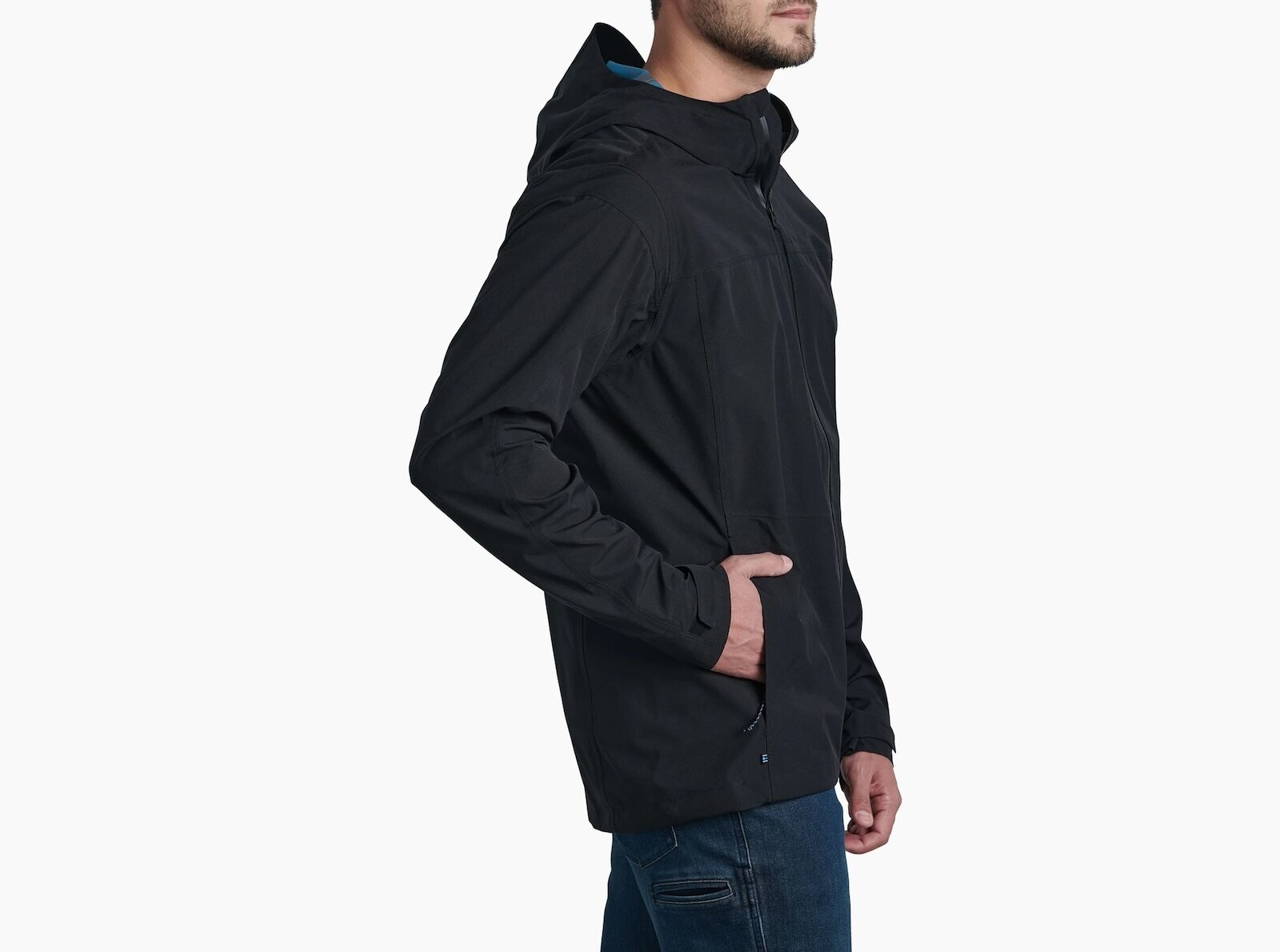 man standing sideways in kuhl stretch voyagr jacket