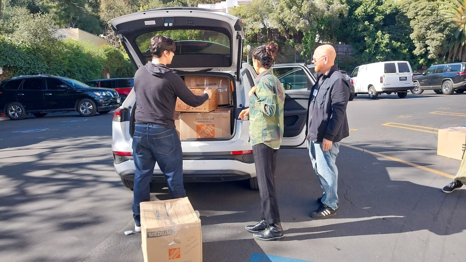 volunteers packing boxes in car for la wildfire victims