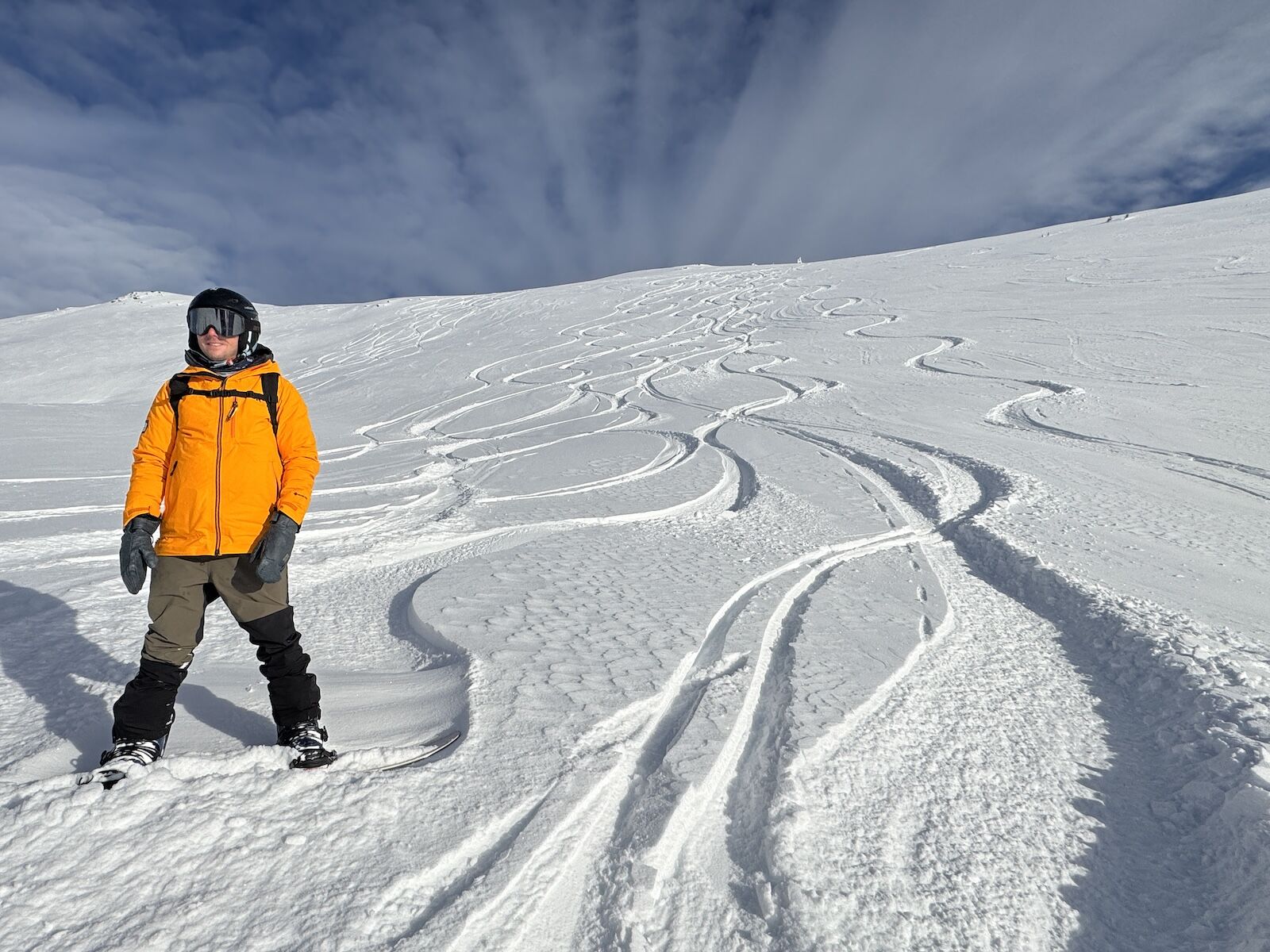 man snowboarding in outdoor research hemispheres shell