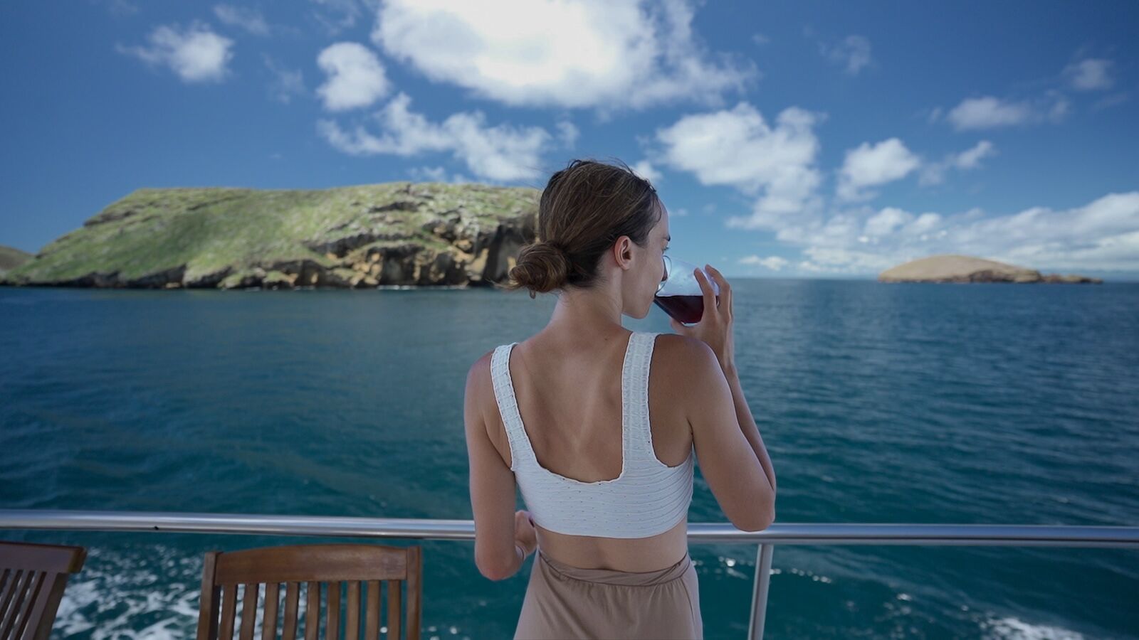 sustainable luxury tourism - woman on pikaia yacht