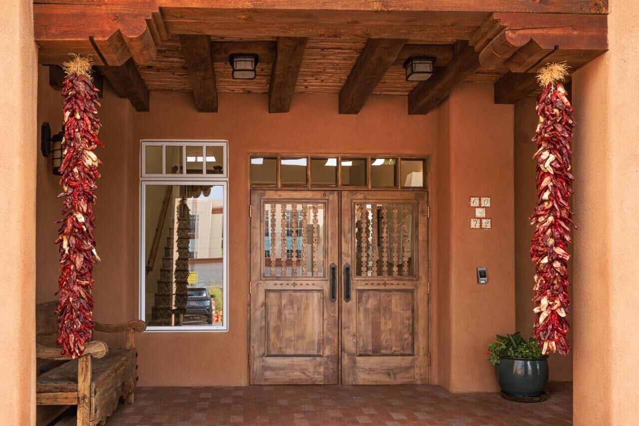 doors with hanging dried chiles at pinon court by la fonda in santa fe new mexico