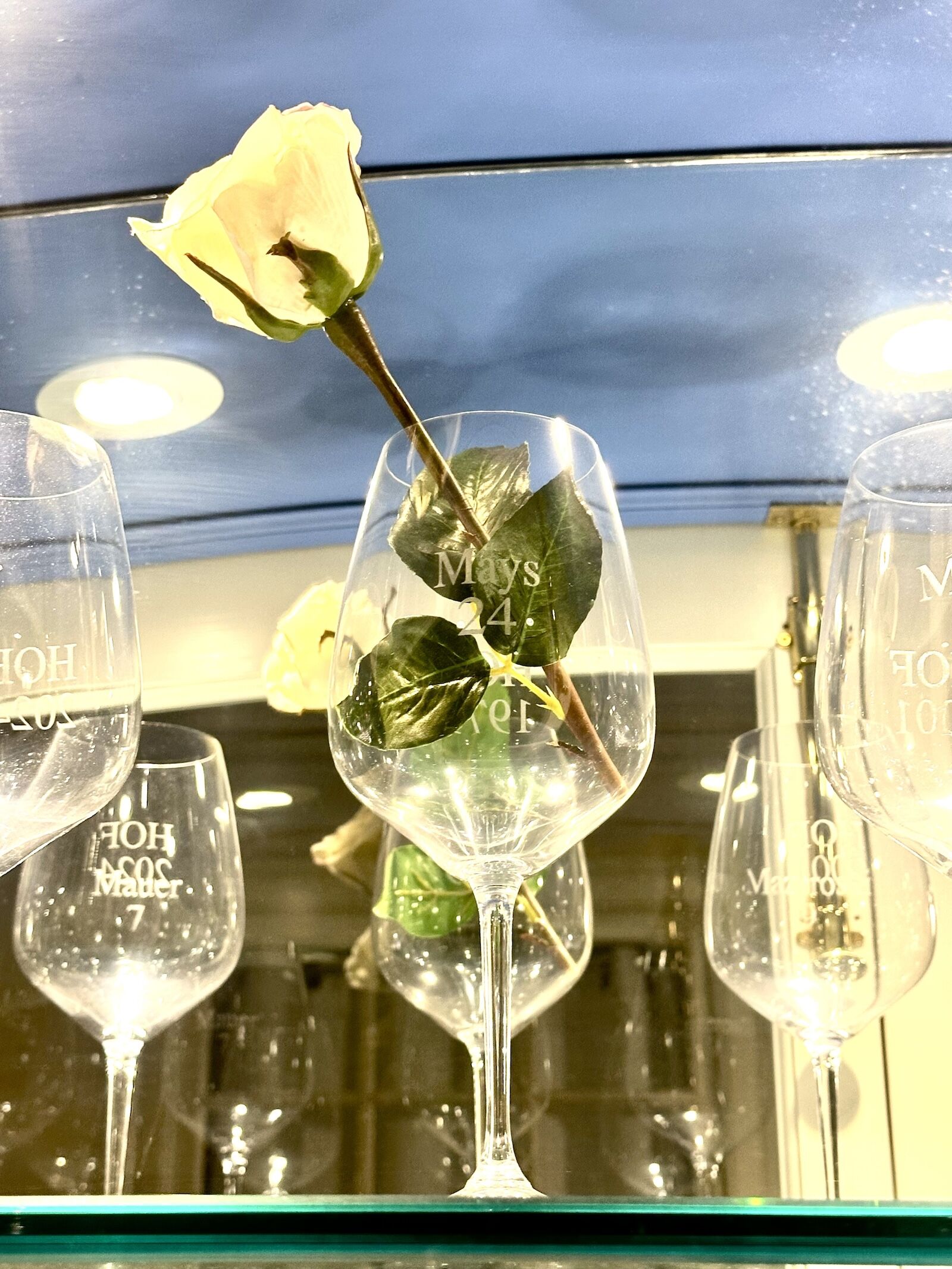 flower in willie mays wine glass at otesaga resort