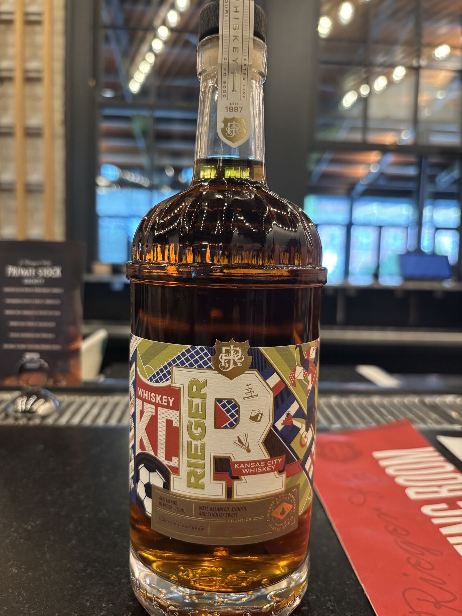 bottle of J. Rieger whiskey with world cup label