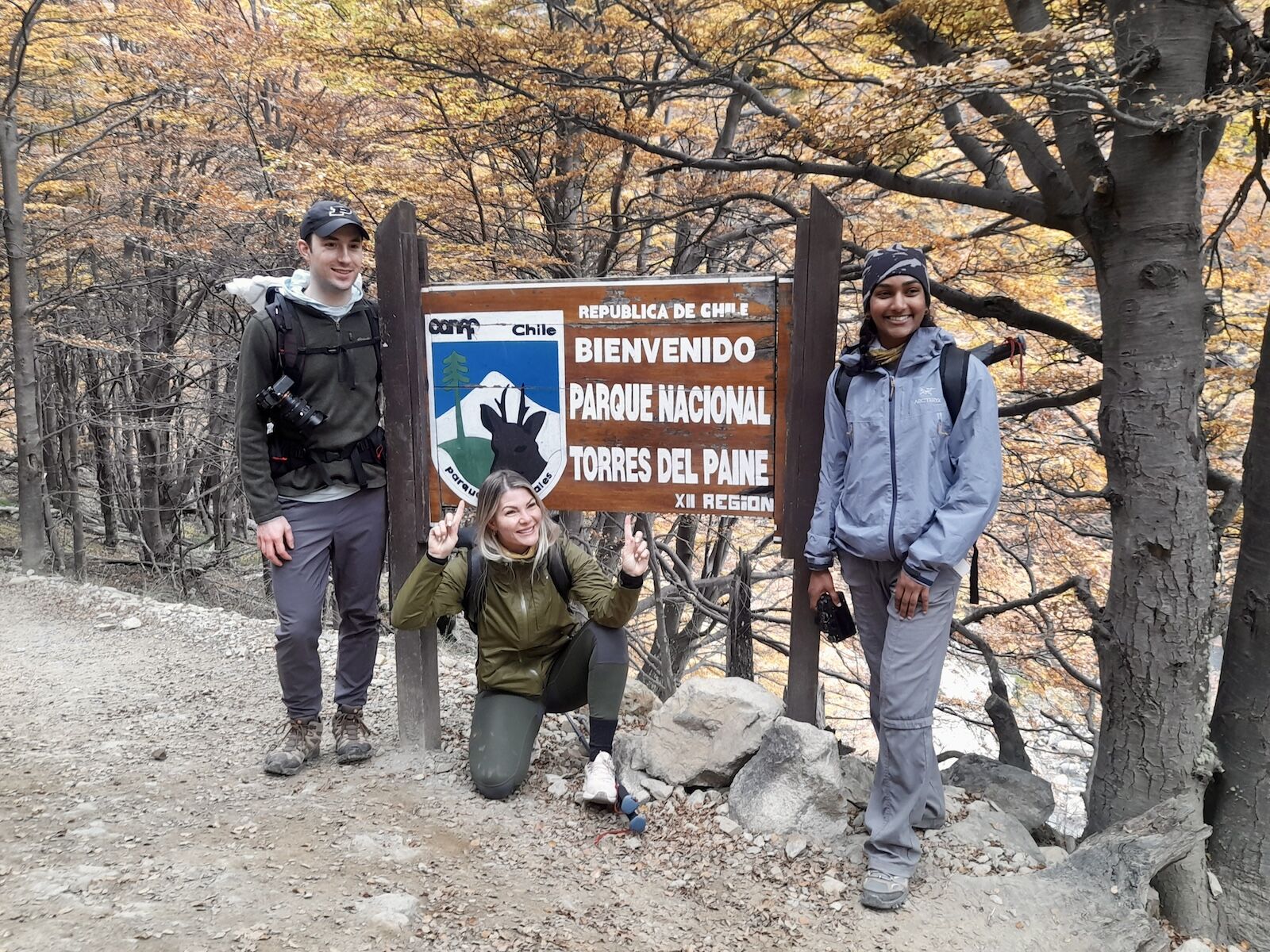 hikers at trail sign in patagonia
