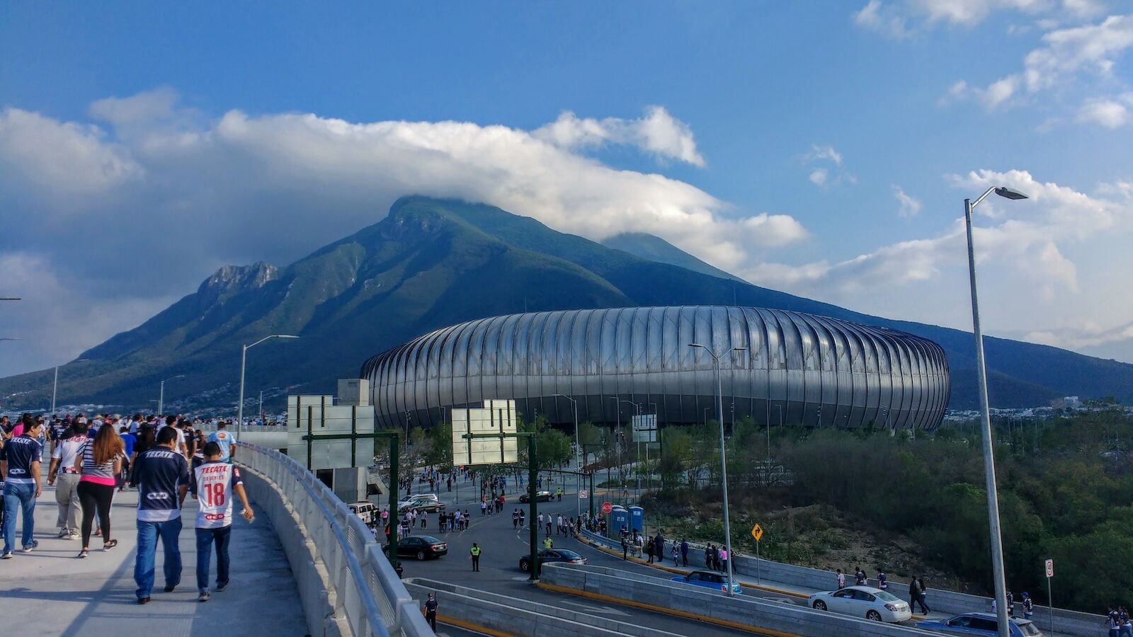 people walking toward monterrey soccer stadium
