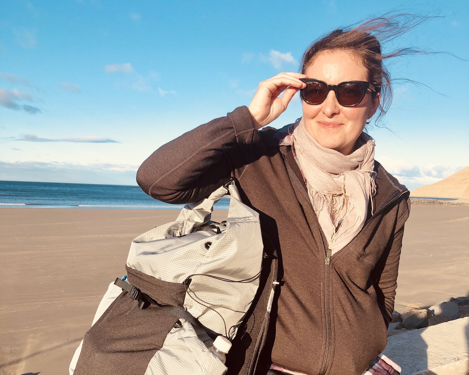 woman wearing ibex mammoth full zip hoodie in the wind