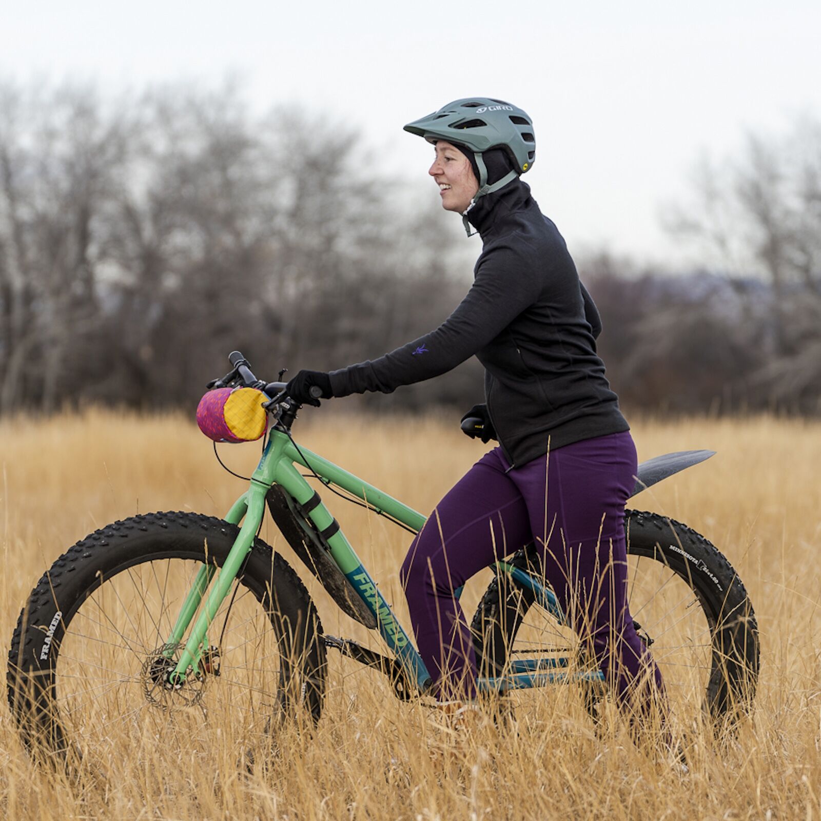 woman on bike in ibex mammoth hoodie
