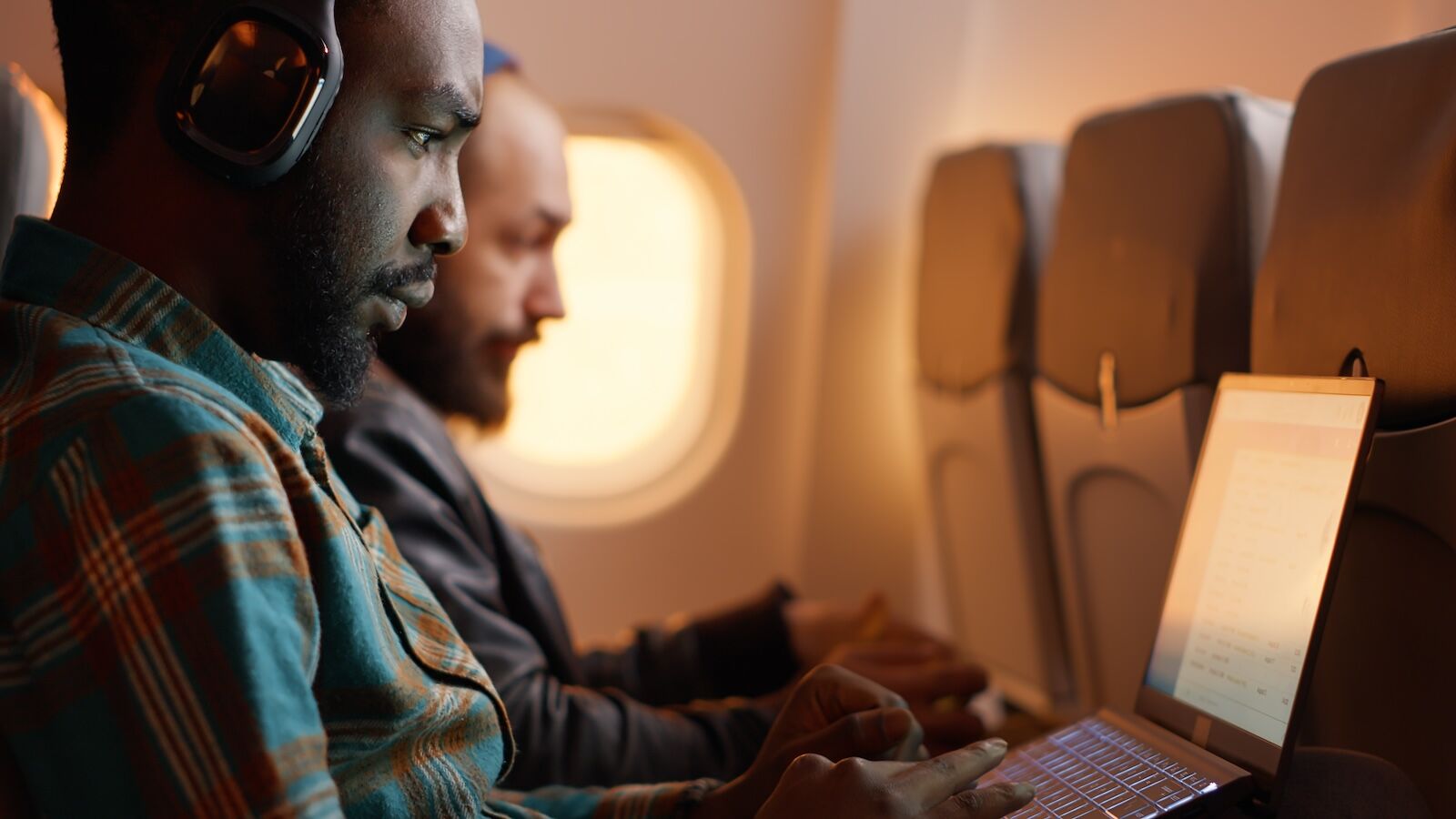 delta ai pricing - two passengers on plane