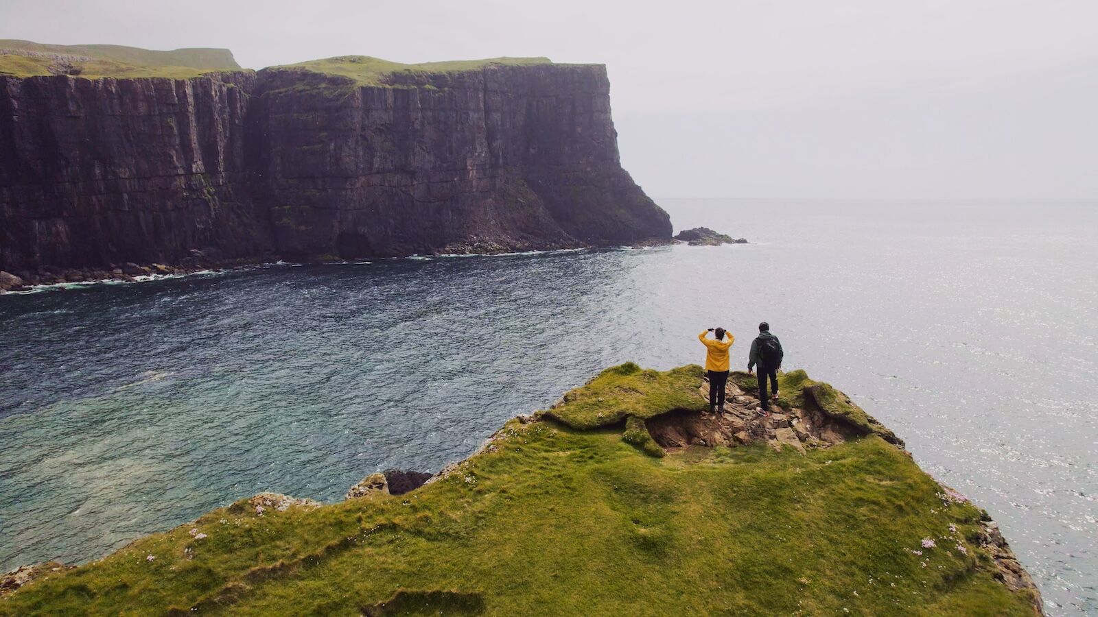 faroe islands road trip mystery route - people on cliff