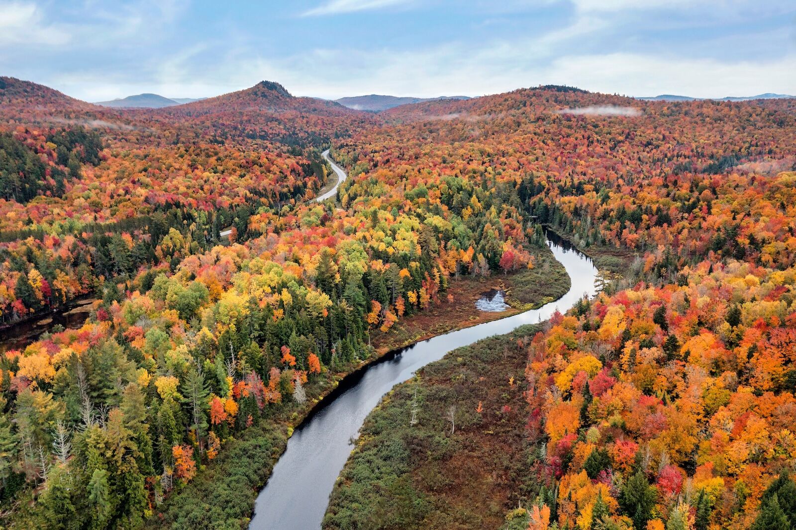 Aerial view of the Bog River near Tupper Lake in Adirondack Park in Upstate New York during fall.