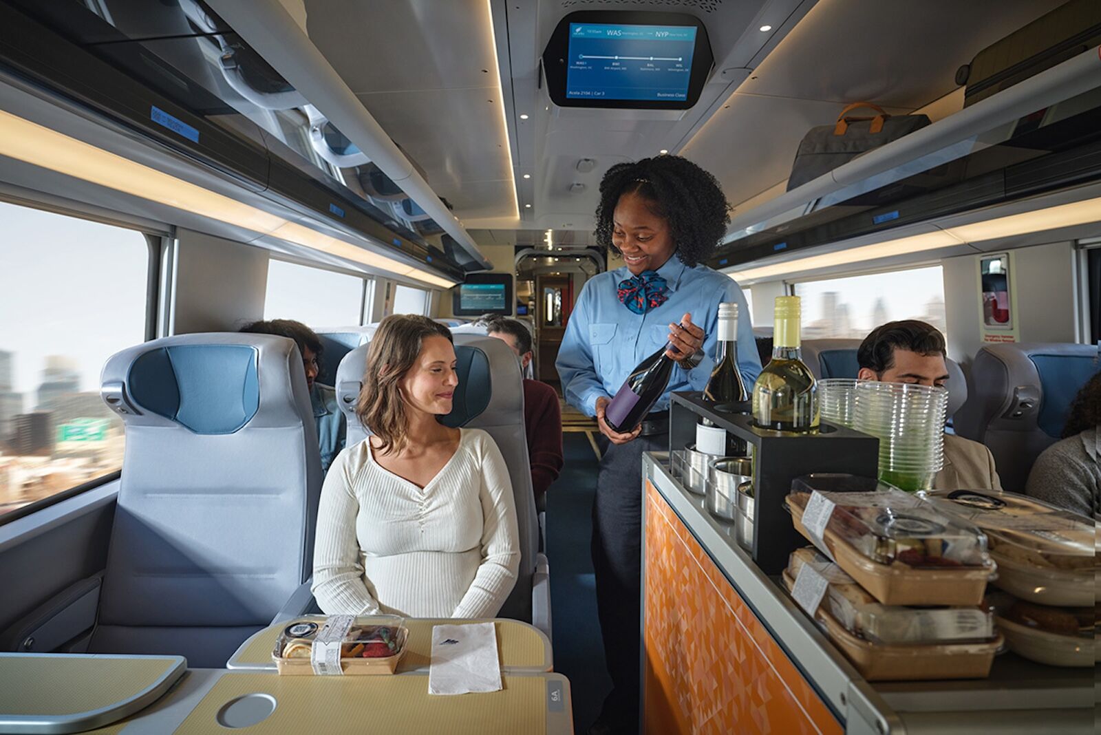 woman serving other woman on amtrak train