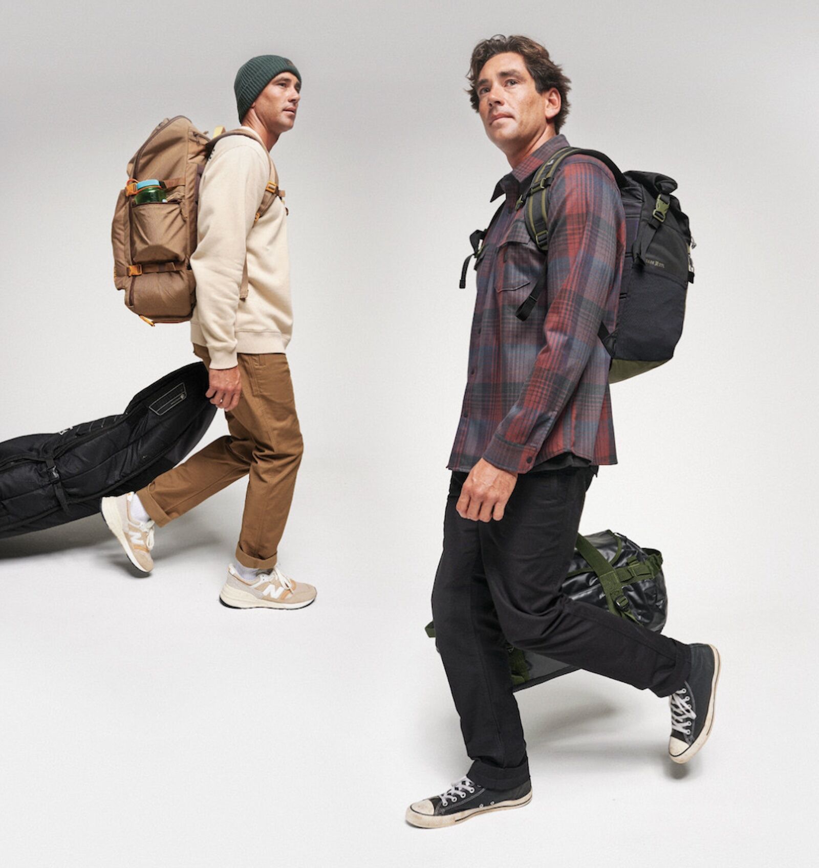 promo shot of men wearing roark layover pant with travel gear