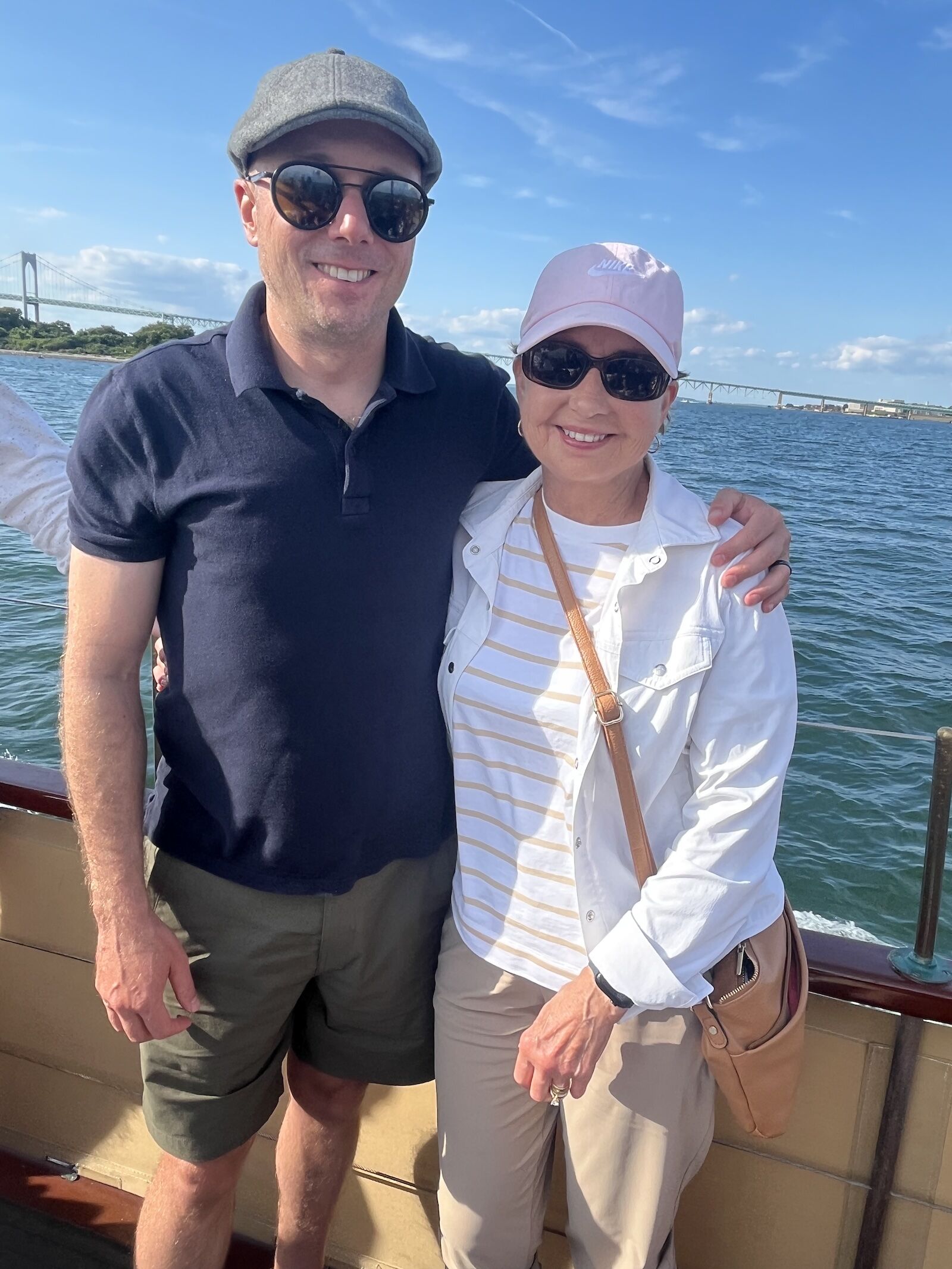 man in roark layover short and his mom on a boat