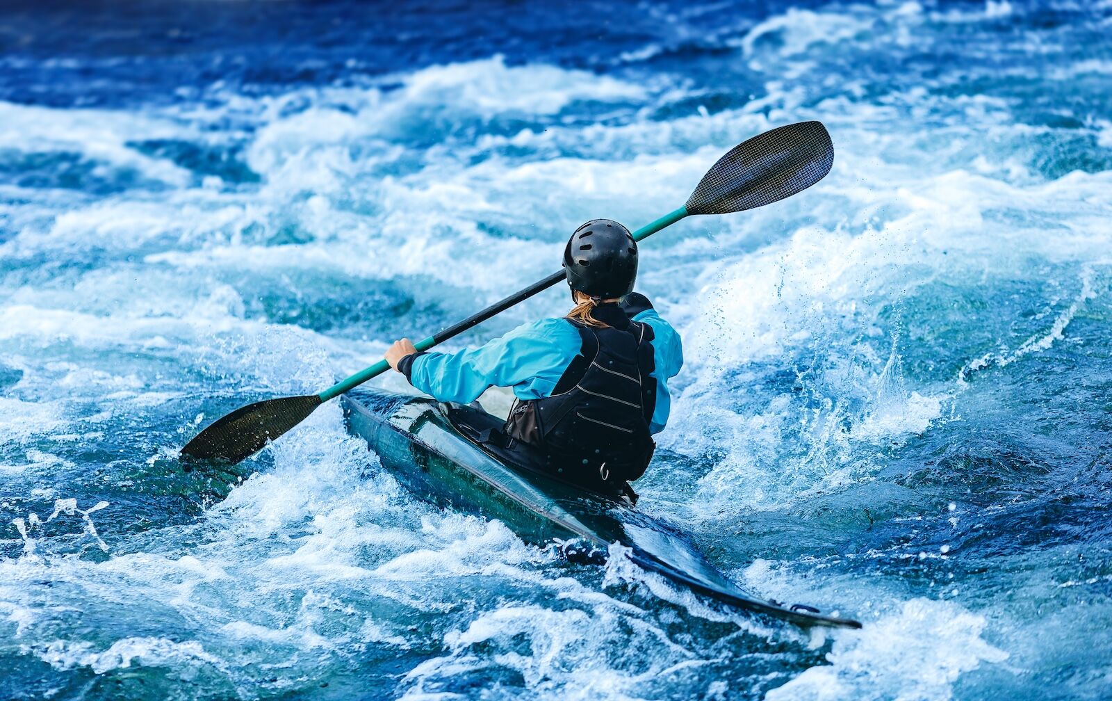 kayaker on whitewater river