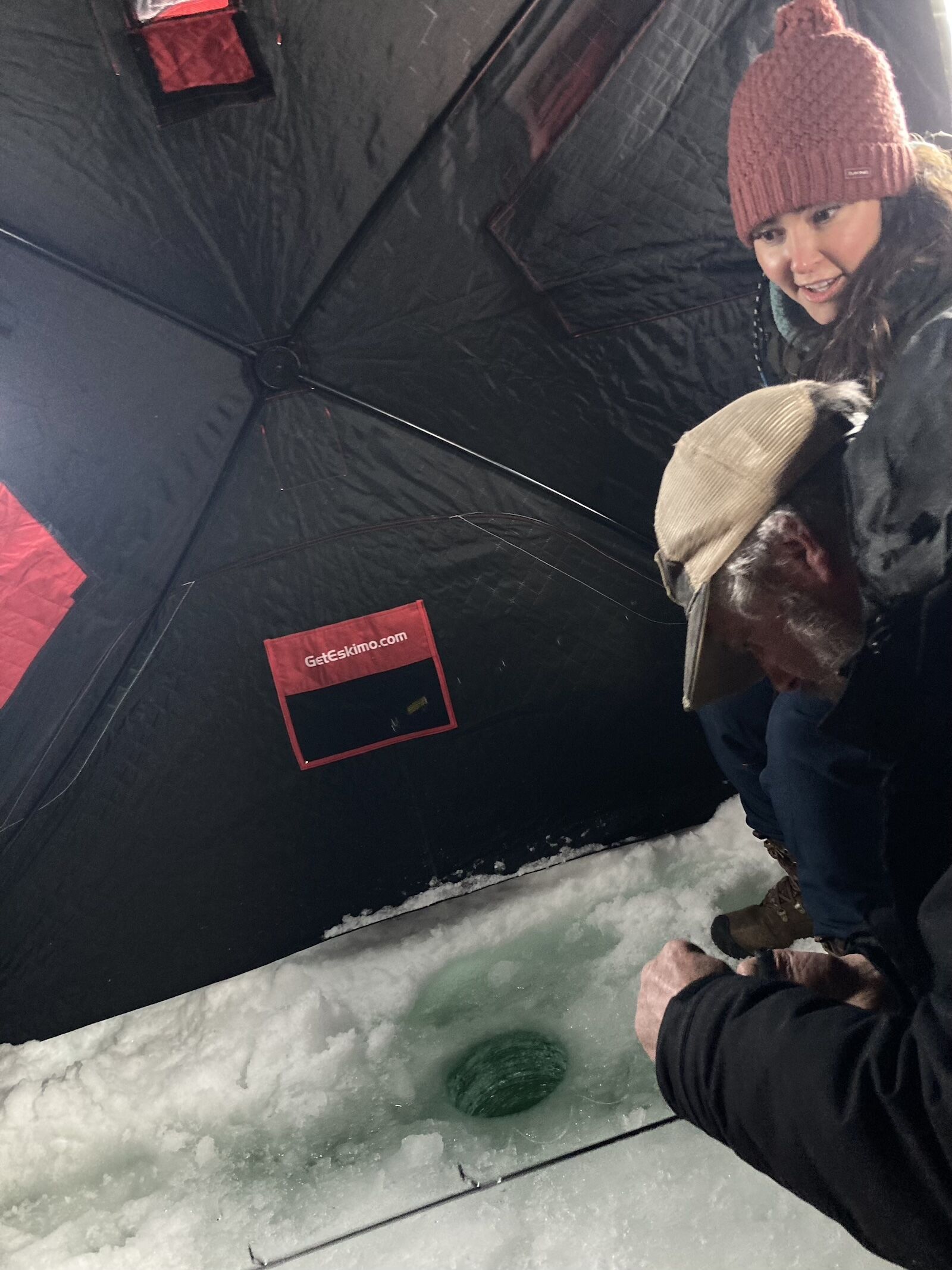 two people ice fishing
