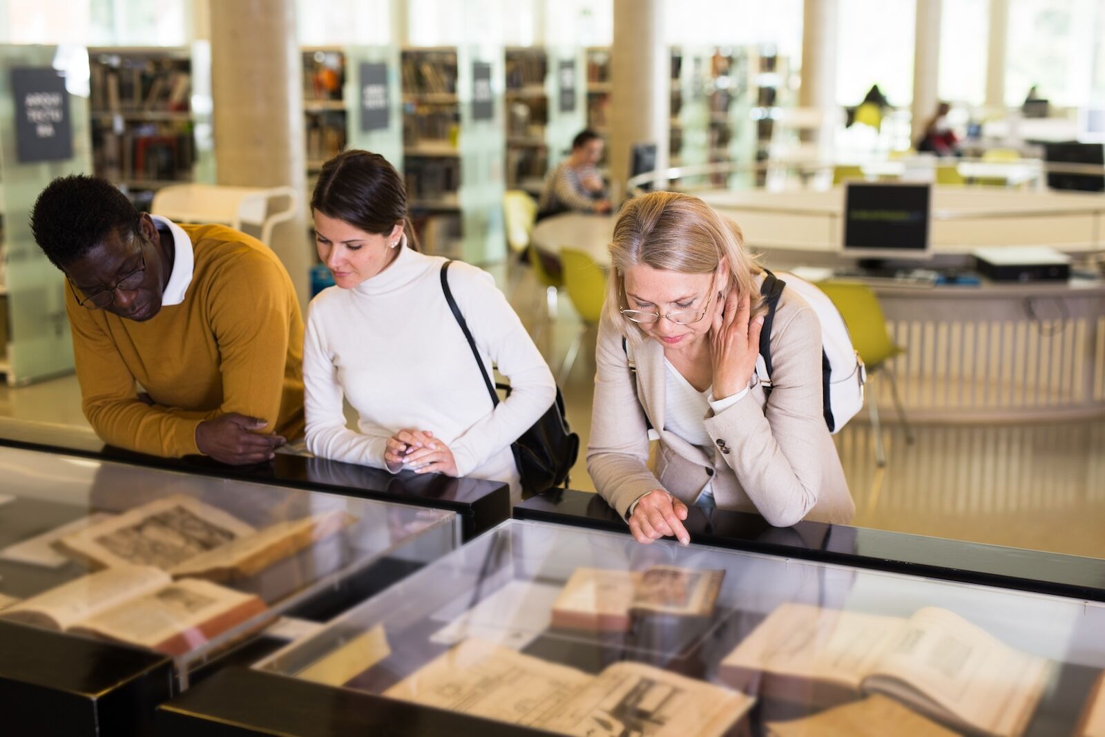 people at a rare book room