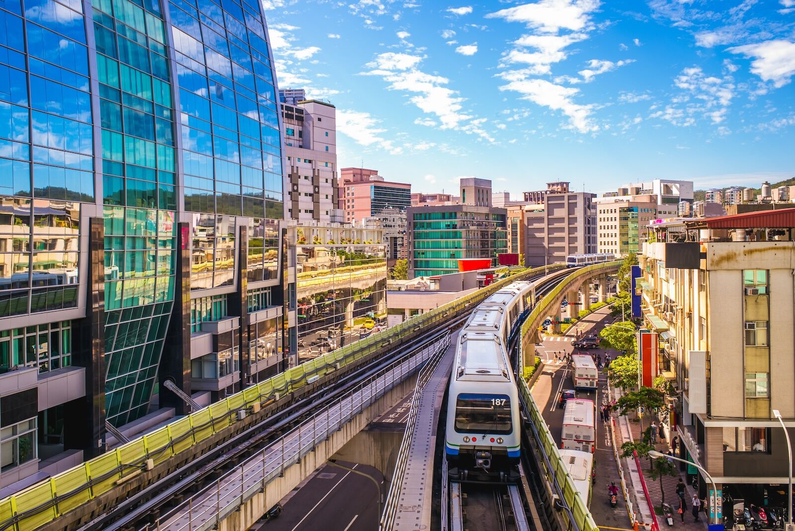 taipei MRT train passing skyscrapers