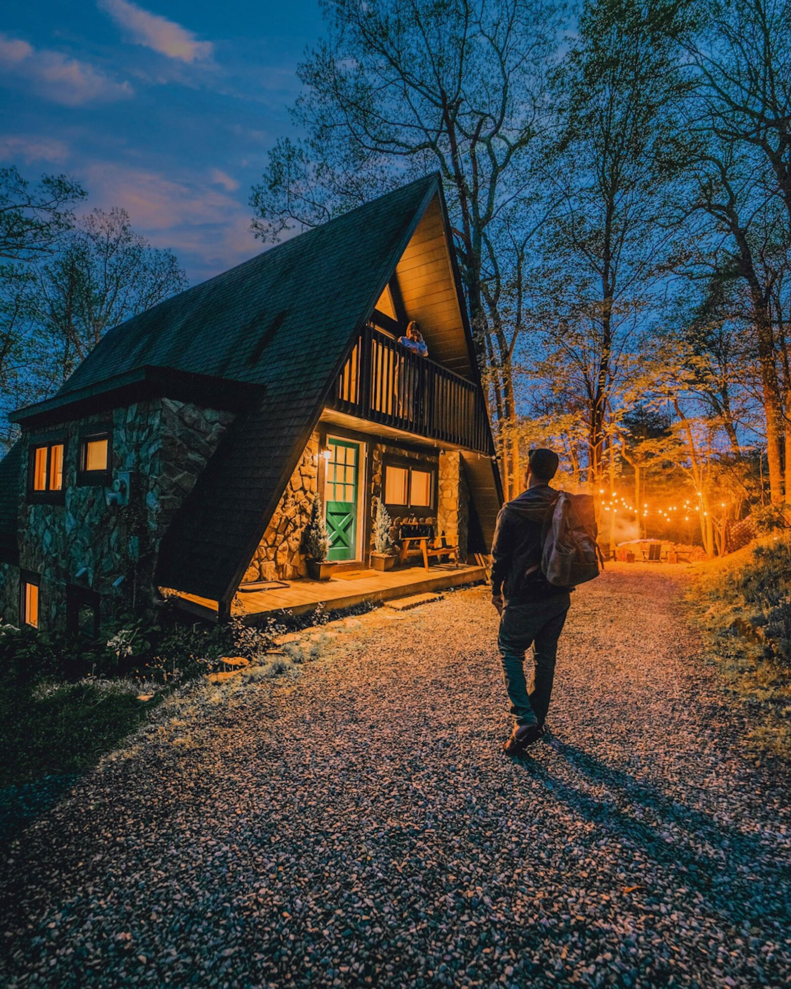 man approaching appalachian a-frame airbnb