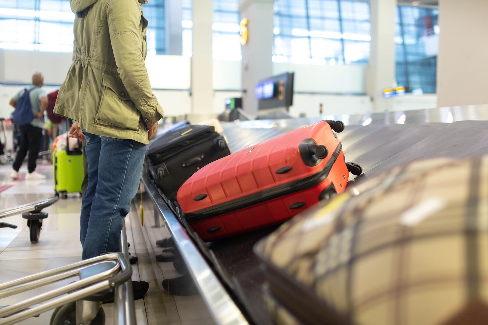 person at baggage carousel