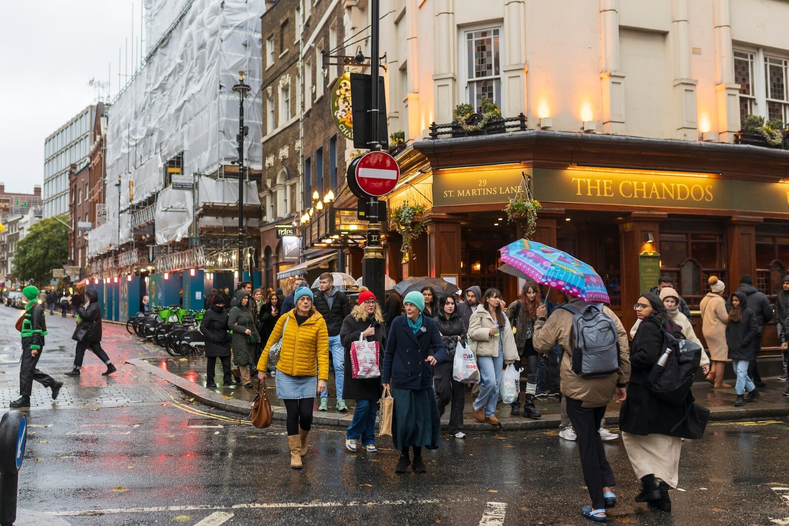 people crossing regent street in london