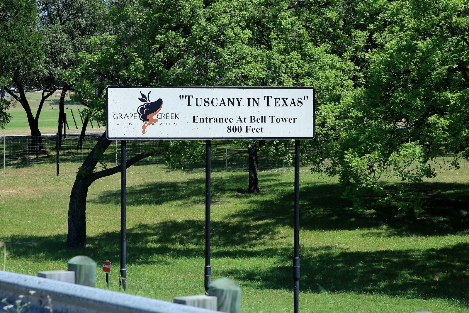 Roadway sign for Grape Creek Vineyards off of the Highway 290 Texas Wine Trail - Stonewall, Texas, USA - May 2, 2020
