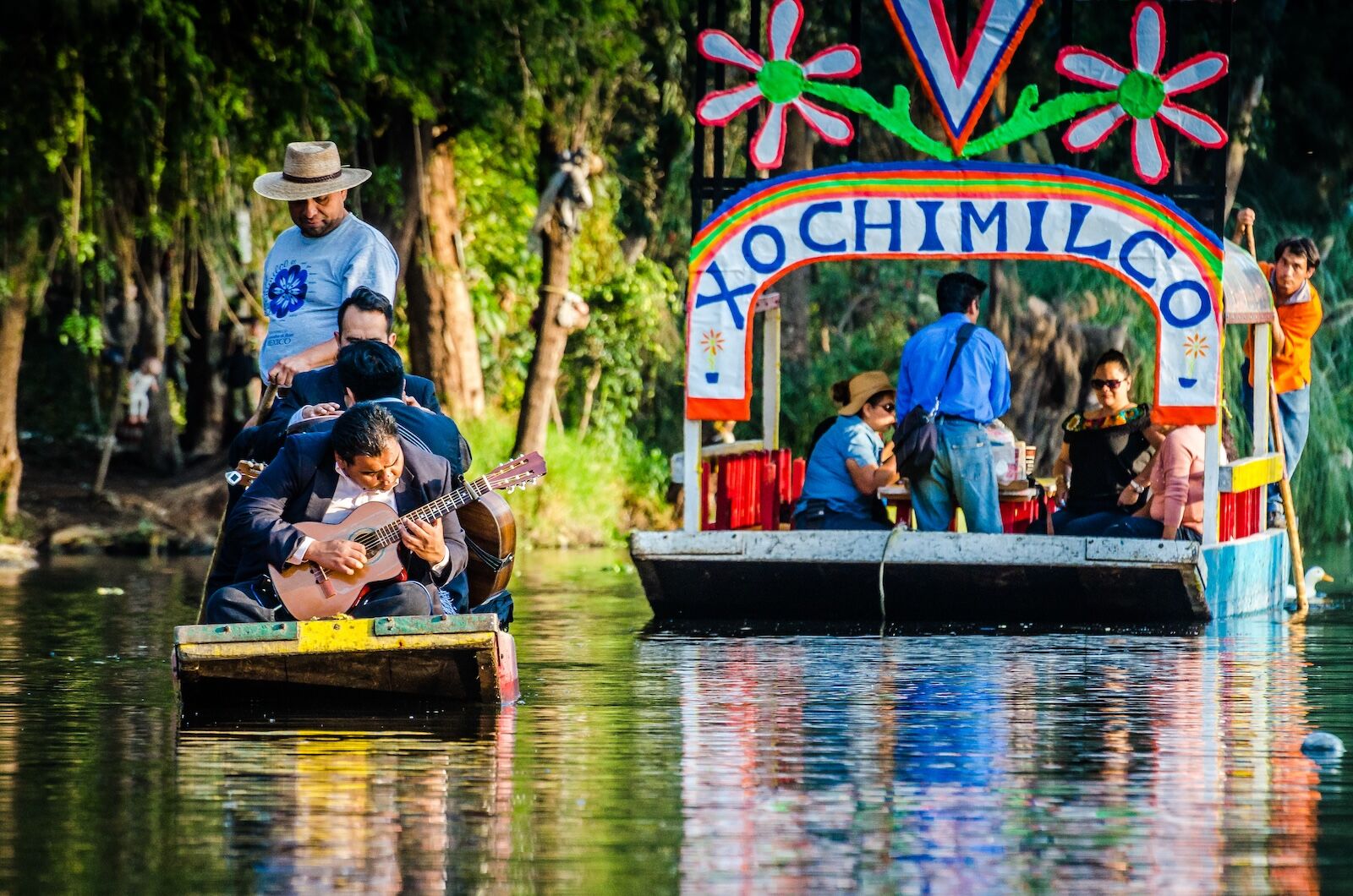 musicians on canal in mexico