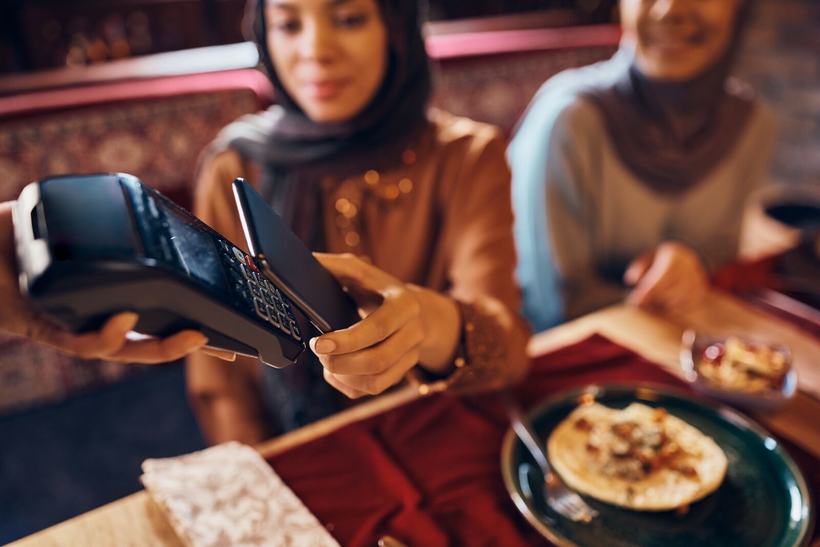 iphone passport - woman scanning at restaurant