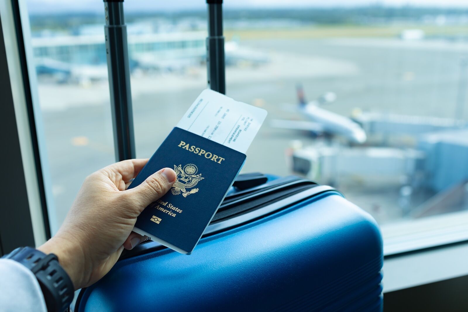 REAL ID fines - passport and suitcase