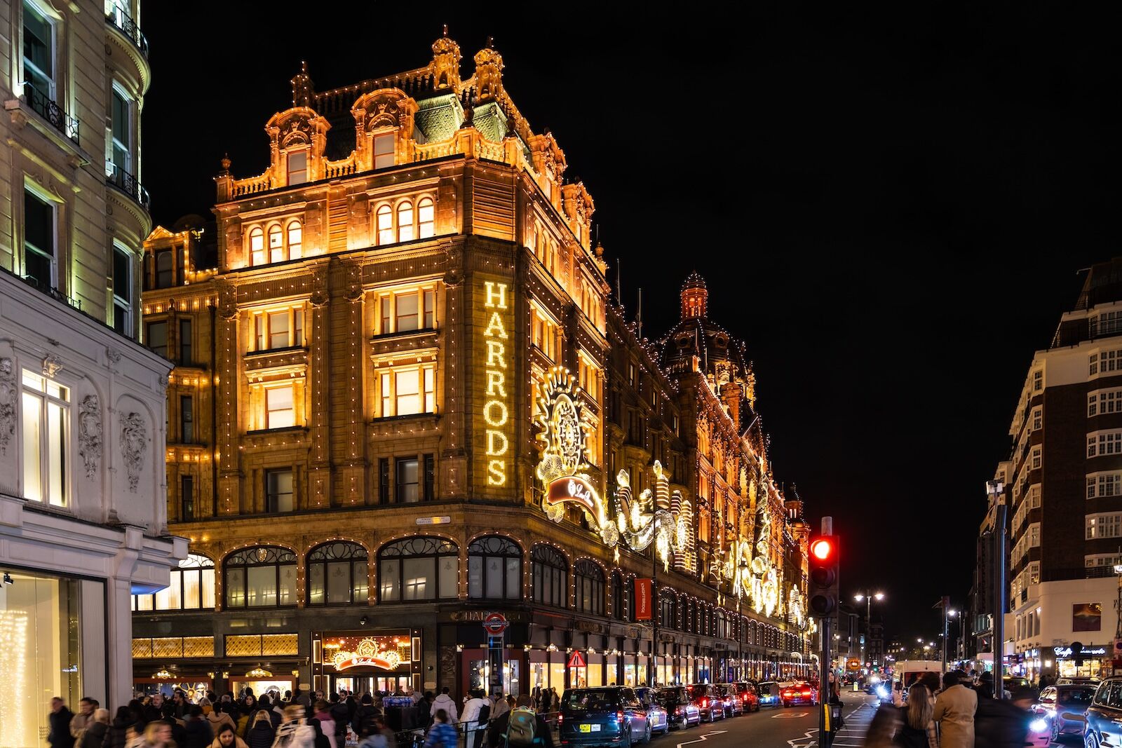 Harrods department store in London at night