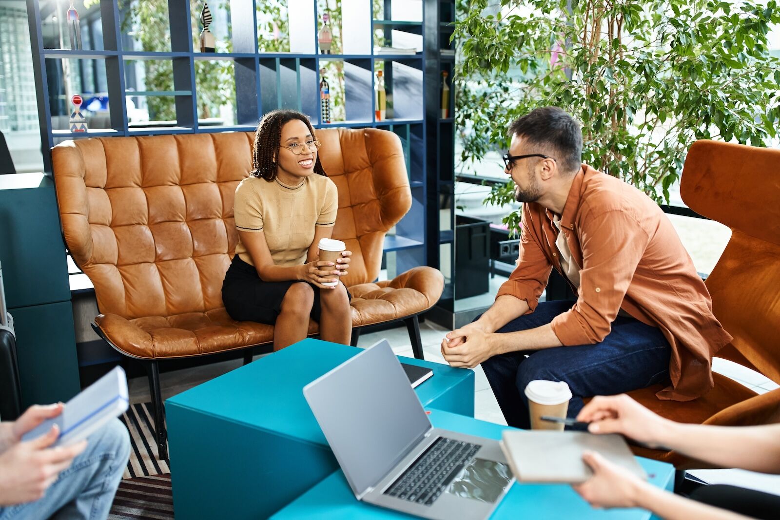 people chatting in hotel lobby
