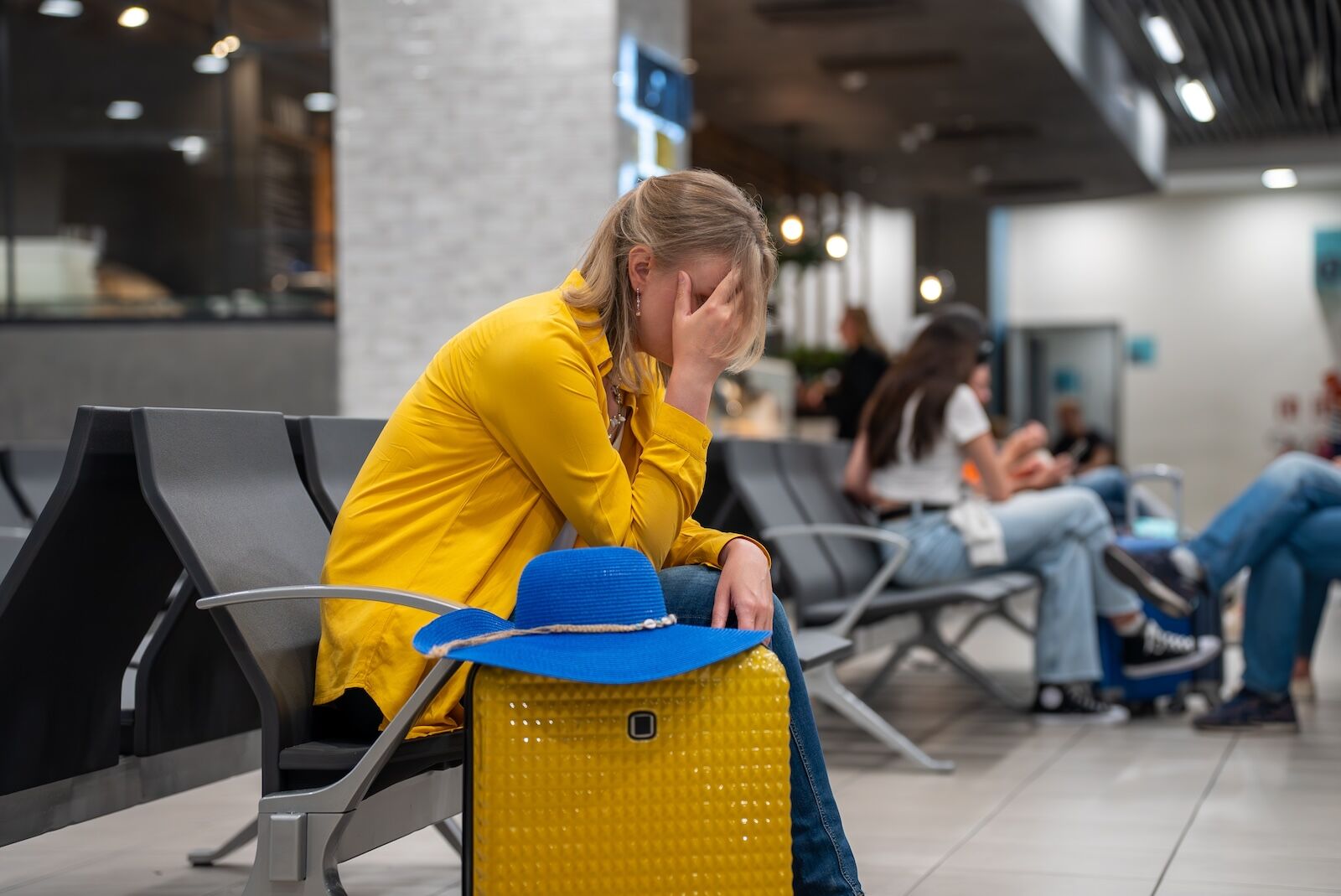 stressed out woman at airport