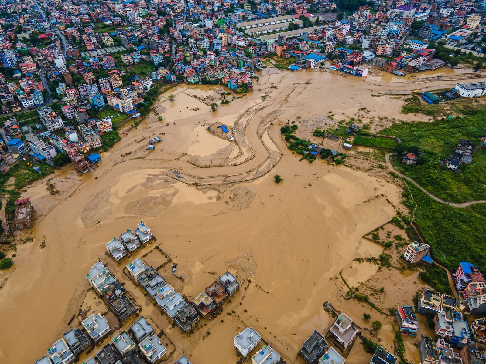 flooded river overtaking city