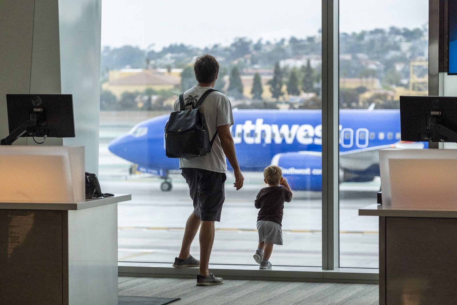 airport guest pass - people waiting at gate