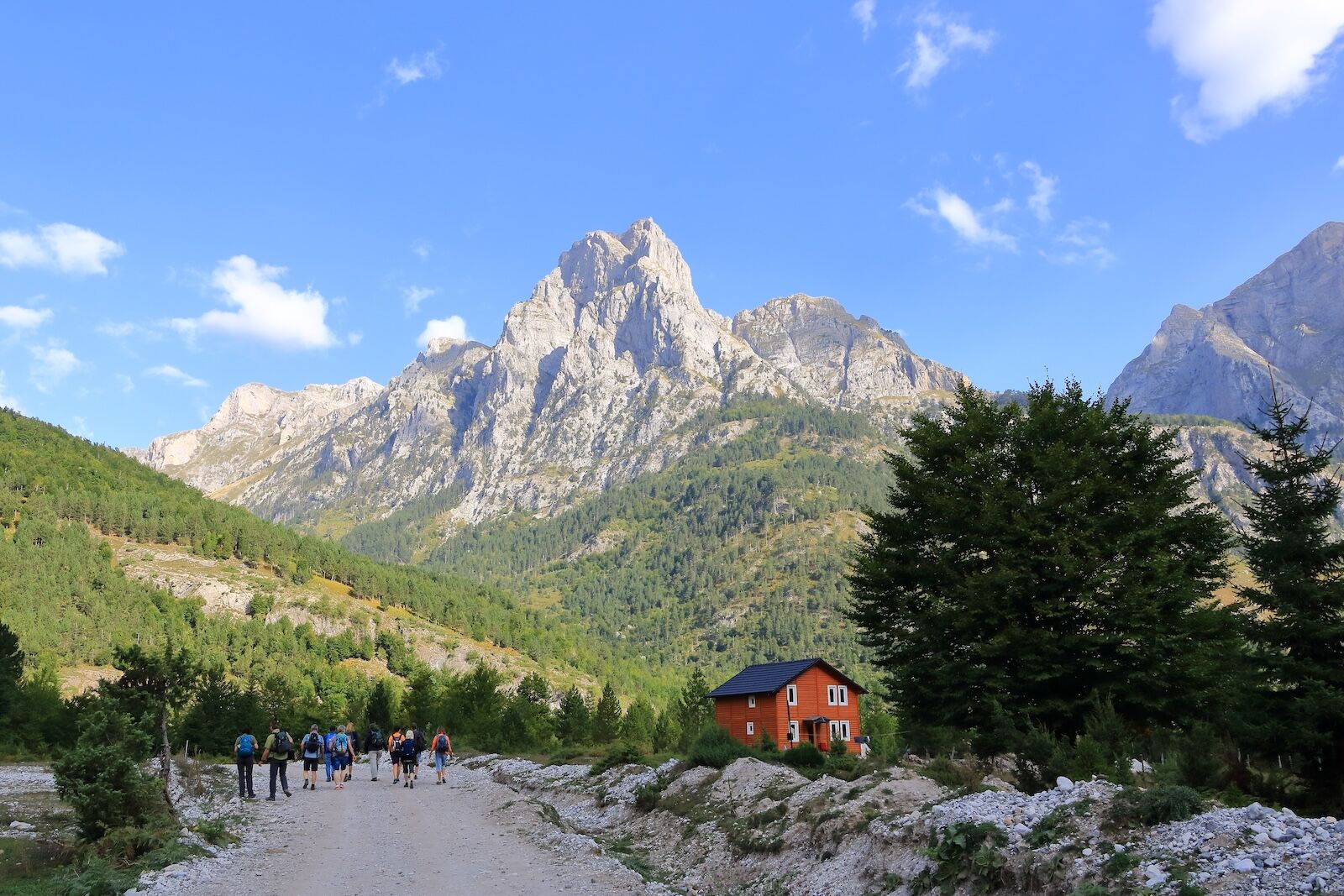 September 21 2023 - Valbona in Albania: People walk on a trail in the Valbona Valley, Theth National Park, Albanian Alps