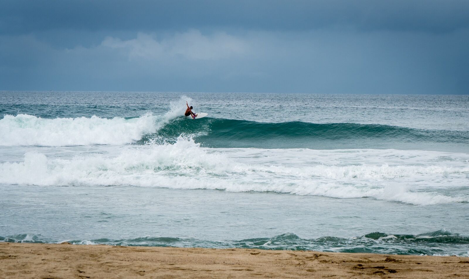Surfers at Playa Zicatela in Oaxaca Mexico