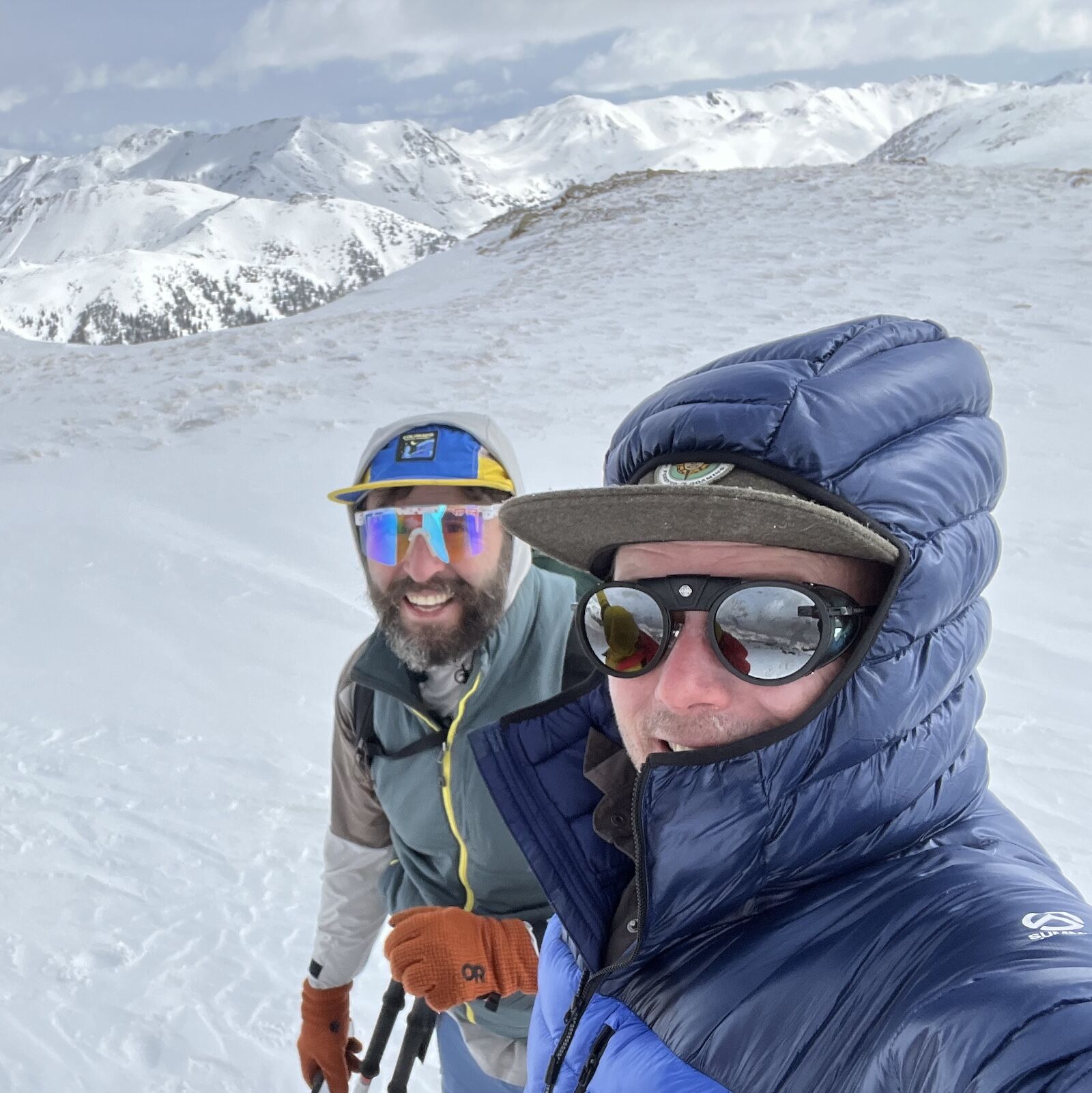 two skiers on top of mountain