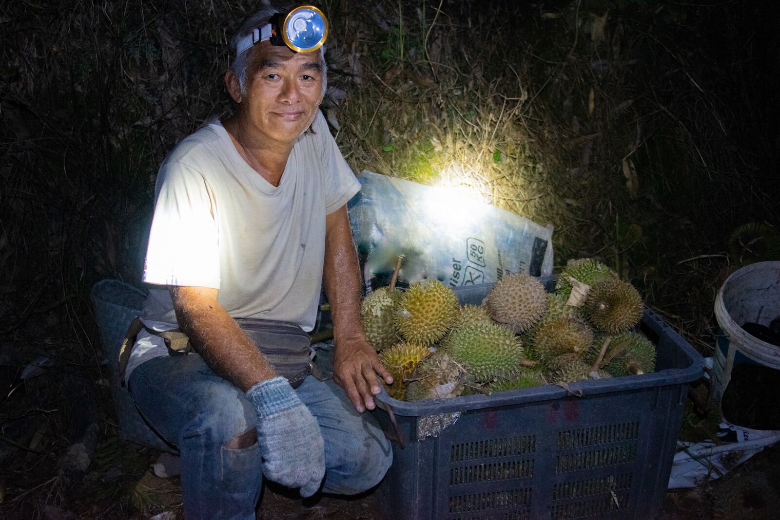 a durian farmer in malaysia photographed by Ian Poh Jin Tze