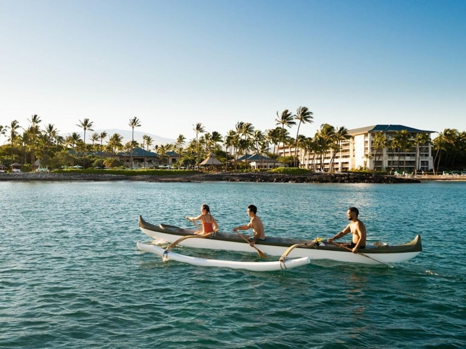 boaters in ocean outside fairmont orchid hawaii