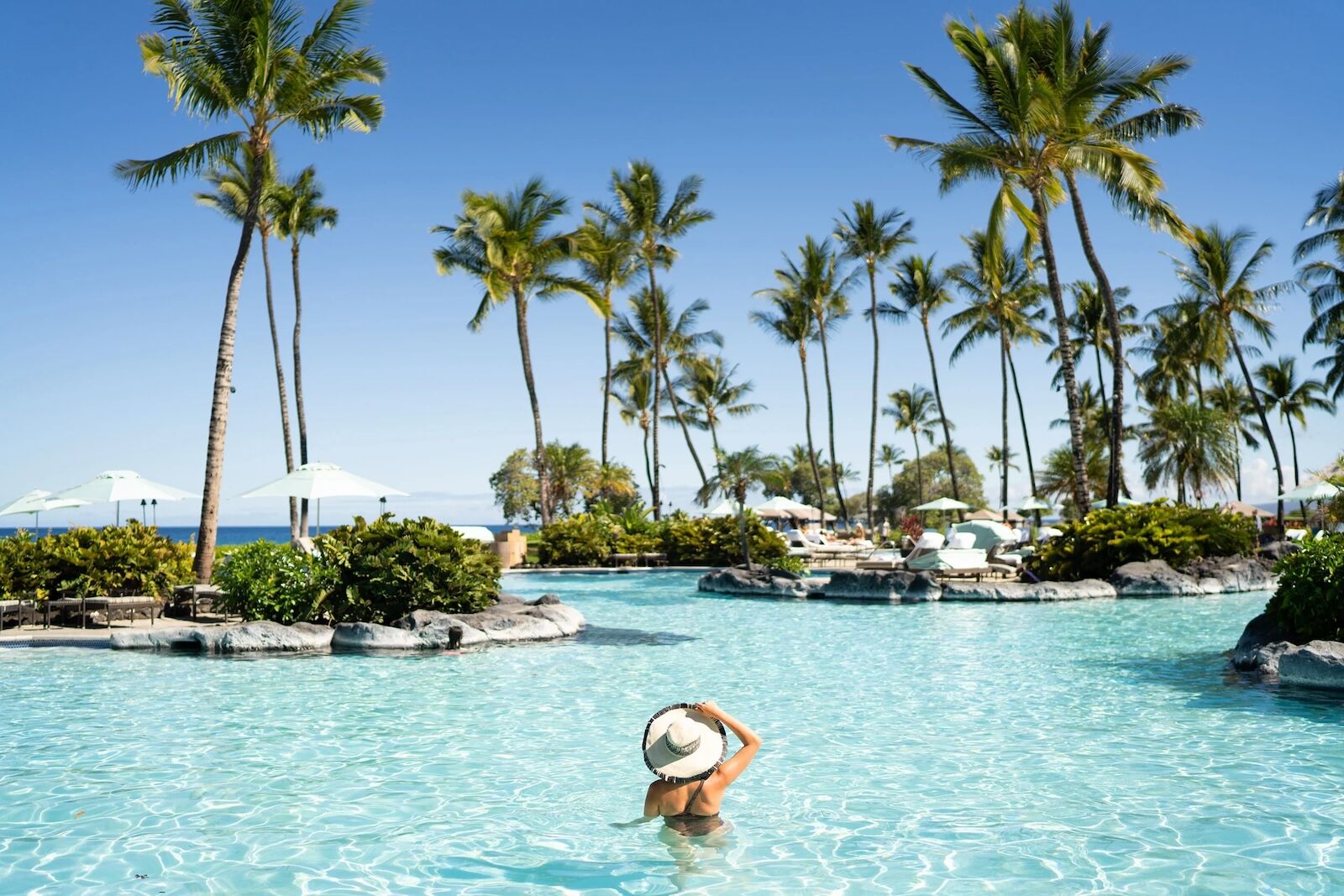 woman in pool at fairmont orchid hawaii