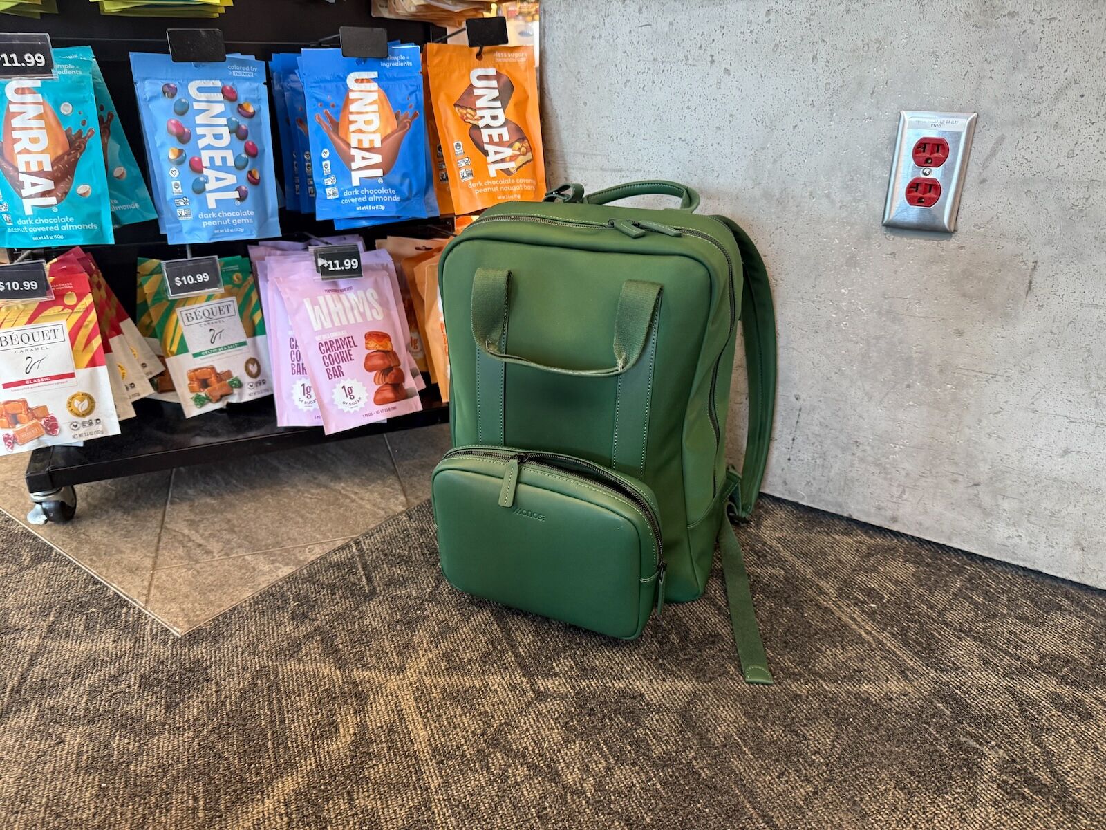monos metro backpack - on floor in airport