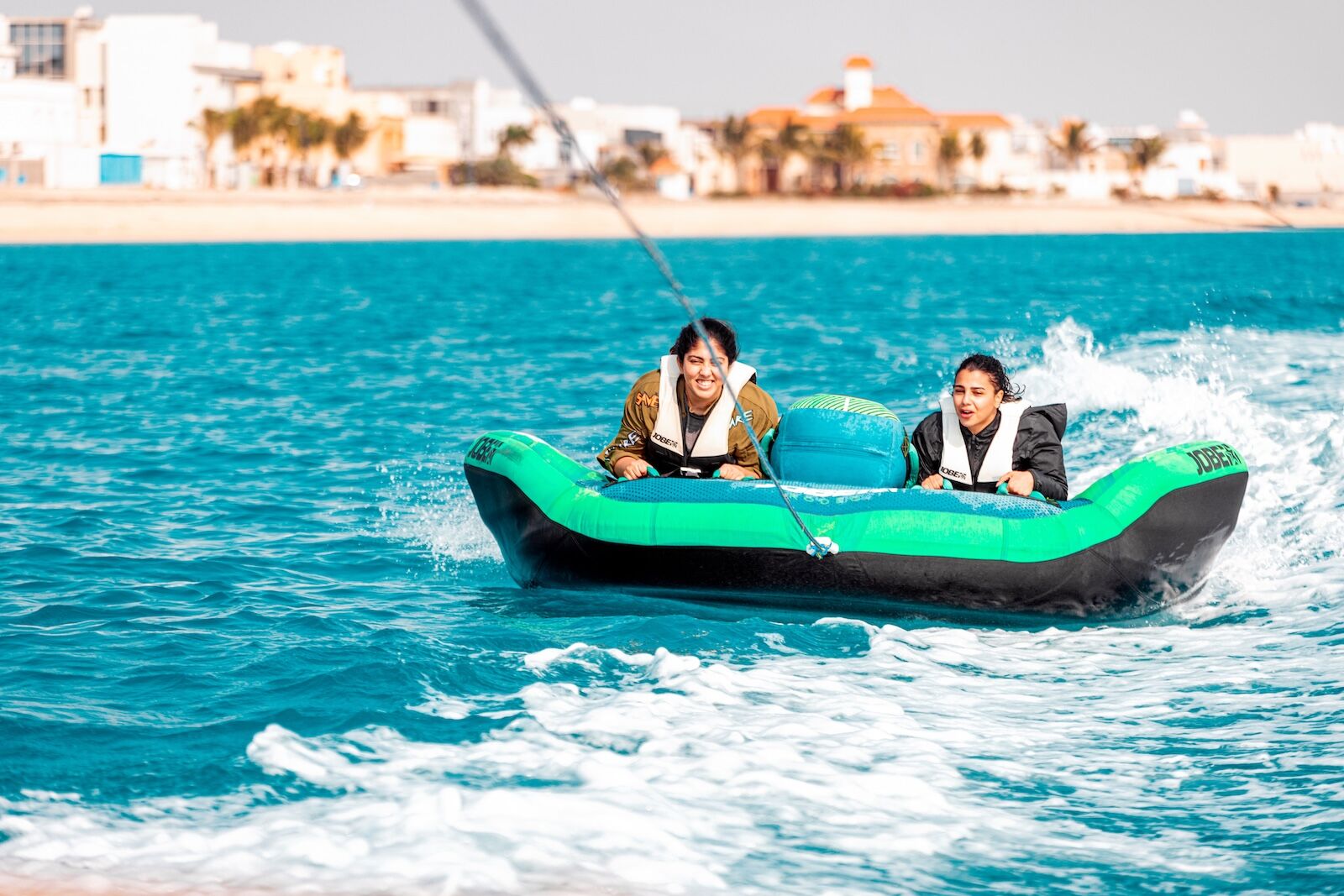 saudi arabia women's beaches - woman tubing