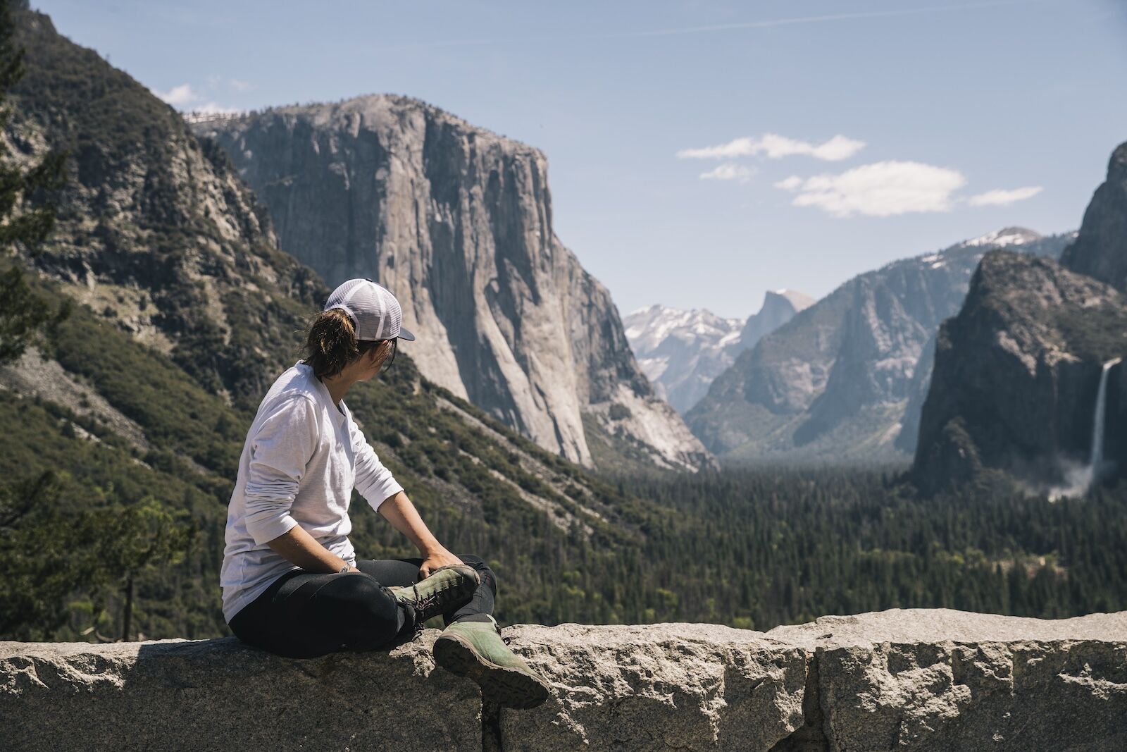 person sitting at tunnel view yosemite