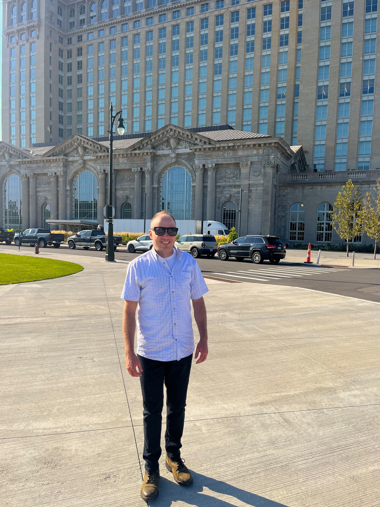 man in poncho clinch knot shirt